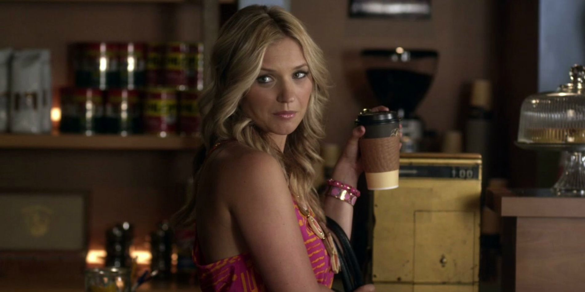 Charlotte holding a cup of coffee in Pretty Little Liars