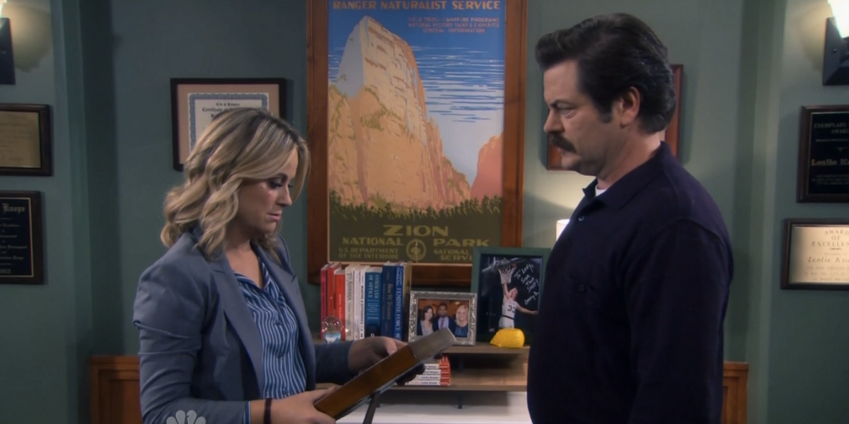Ron and Leslie face off in the office in Parks and Recreation