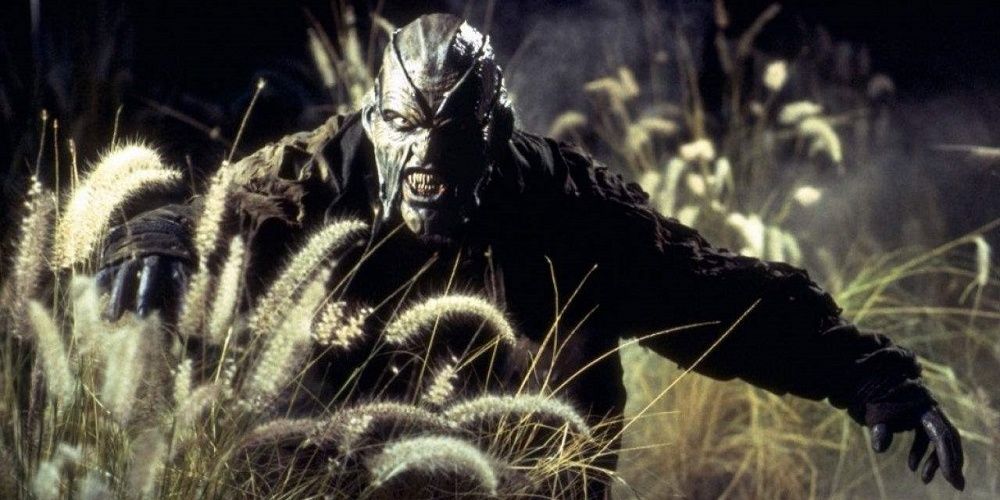 The Creeper walking through a field from Jeepers Creepers