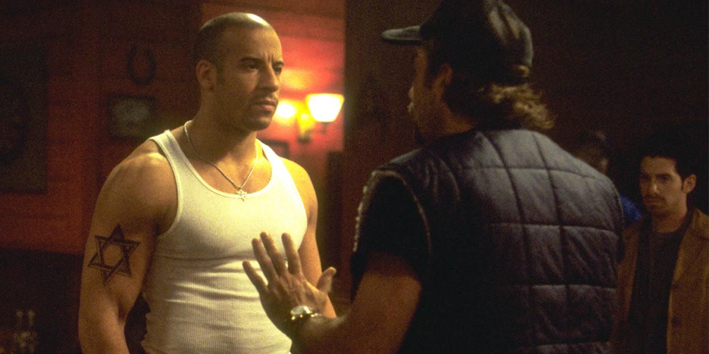 Vin Diesel having a confrontation with a man in a still from Knockaround Guys