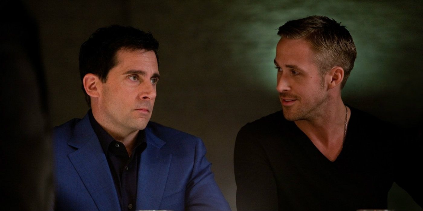 Steve Carell as Cal looking miserable and Ryan Gosling as a smiling Jacob in a bar in Crazy Stupid Love.