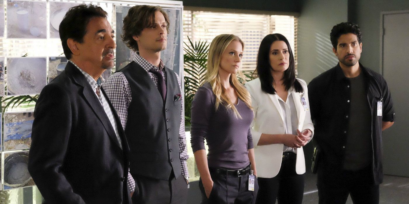The Criminal Minds team stands together to give a profile in front of an evidence board