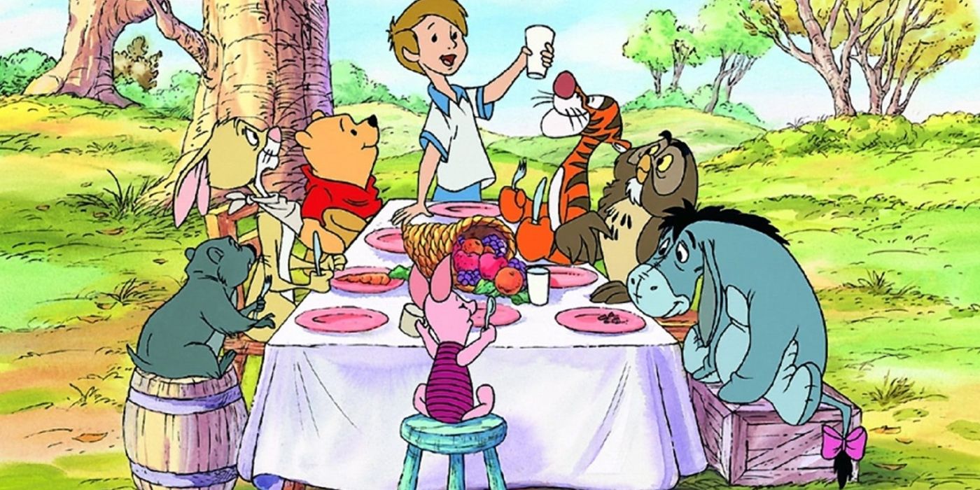 Christopher Robin holding up a cup for a toast in Winnie the Pooh