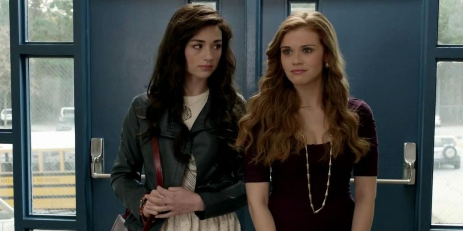 Allison and Lydia stand at the entrance to the school in Teen Wolf