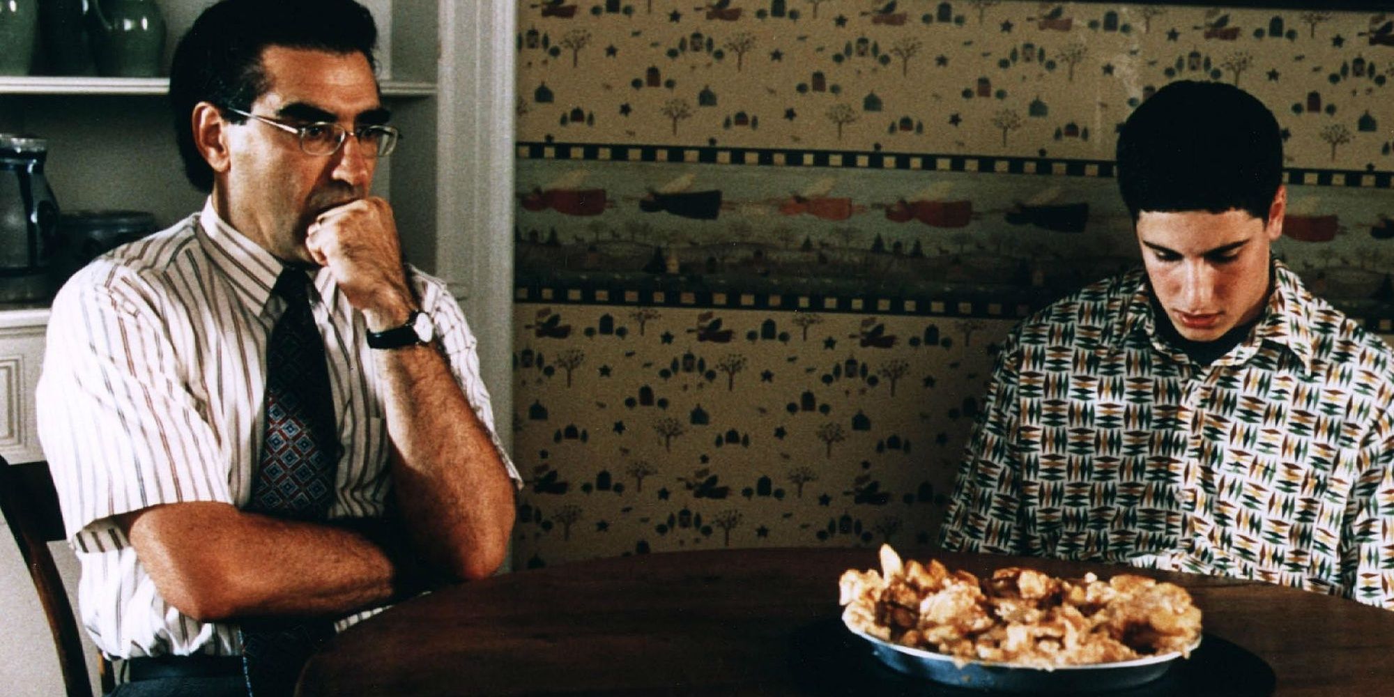 Eugene Levy and Jason Biggs at the table with the pie in American Pie
