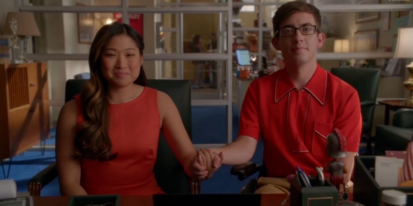 Artie and Tina hold hands while sitting at Figgins office on Glee