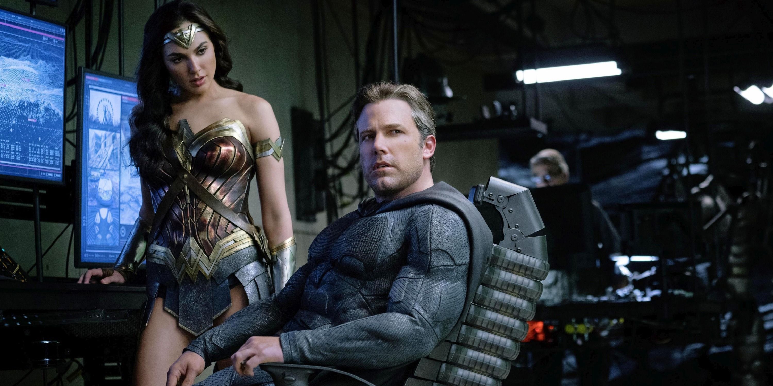 An image of Wonder Woman talking to Batman, who is sitting in a chair in Justice League