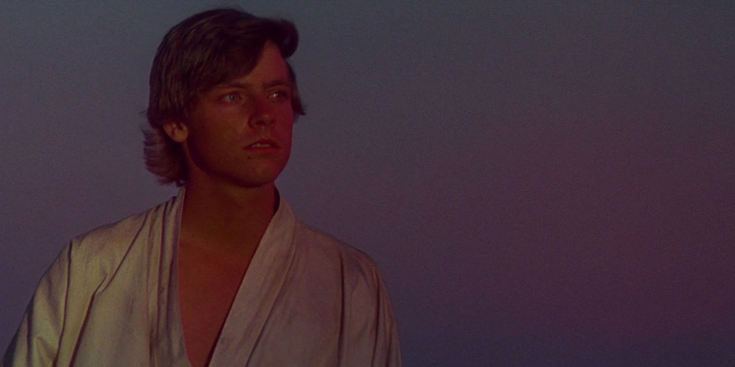 Luke Skywalker looks out at the twin suns/binary sunset on Tatooine in Star Wars: A New Hope