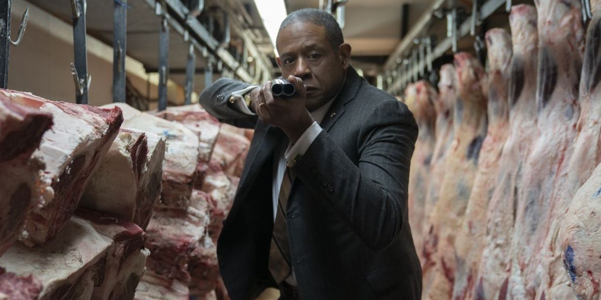 Bumpy Johnson aiming a gun in a slaughterhouse in Godfather of Harlem