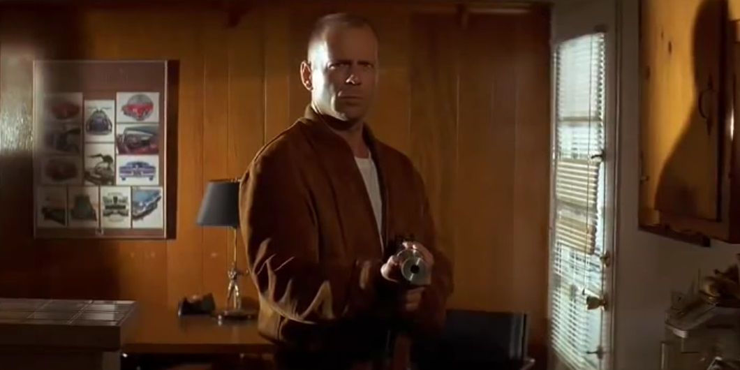 Butch points a gun in Pulp Fiction.