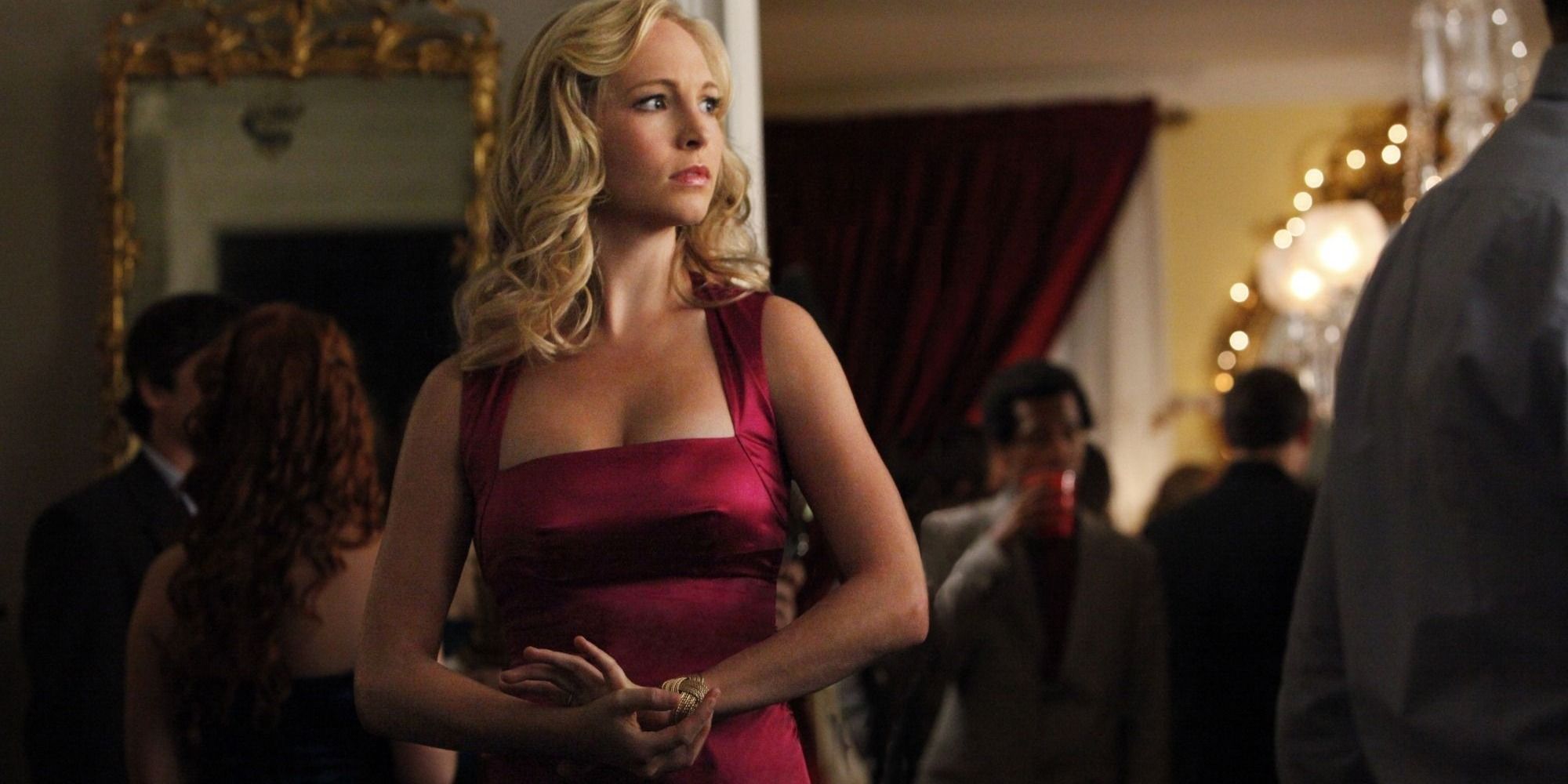 Caroline Forbes in a red dress at a party