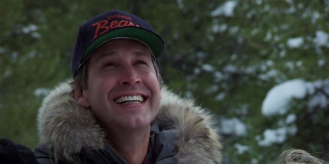 Clark Smiling while standing in the snow in National-Lampoon's-Christmas-Vacation