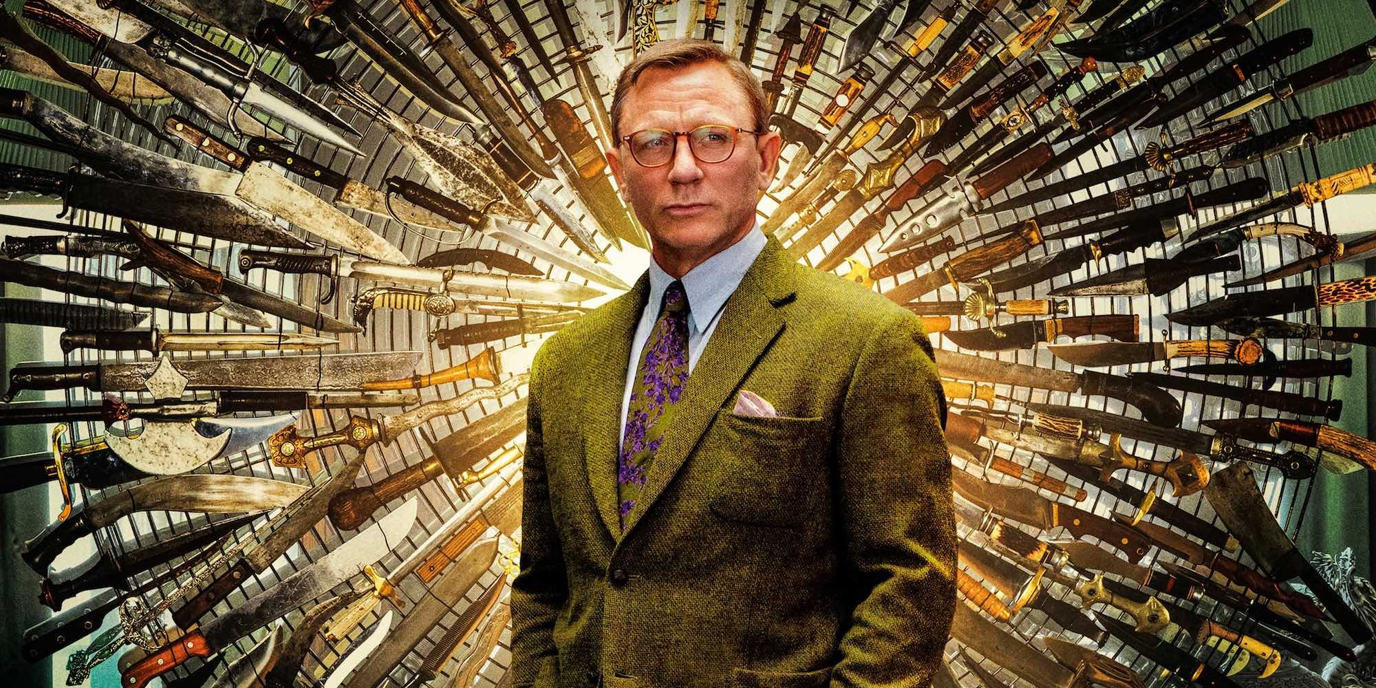 Daniel Craig stands in front of the ring of knives in Knives Out