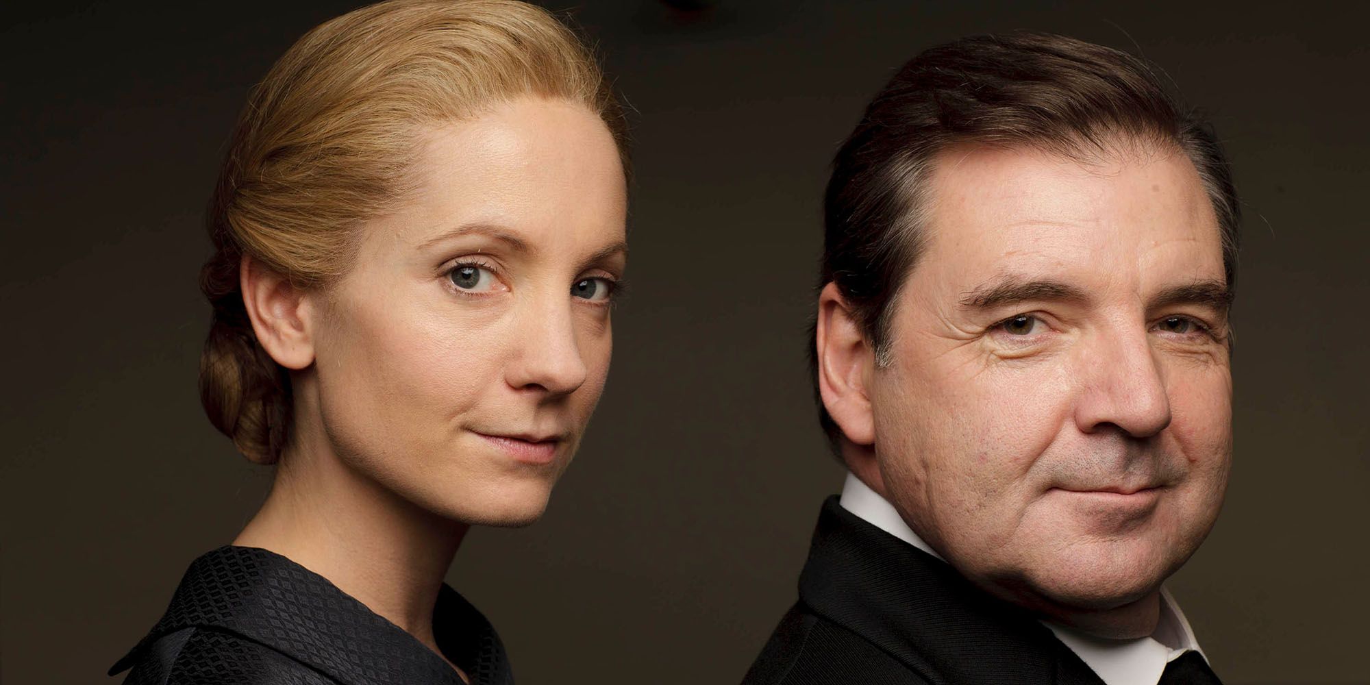 John and Anna Bates posing for the camera in a promo image for Downton Abbey