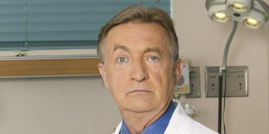 Dr. Kelso raises his right eyebrow for the camera