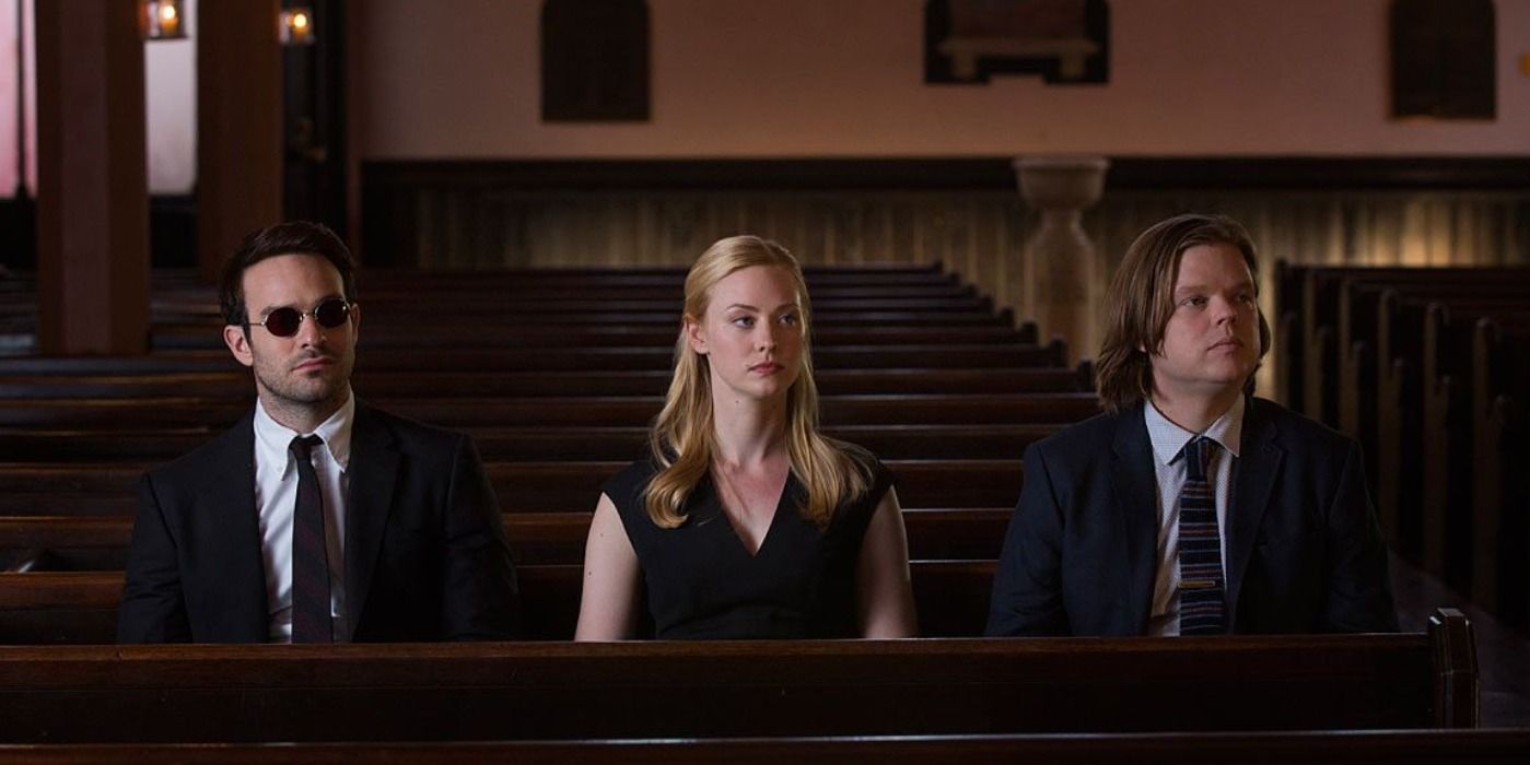 Matt Murdock, Karen Page and Foggy Nelson sat in funeral attire in an empty church.