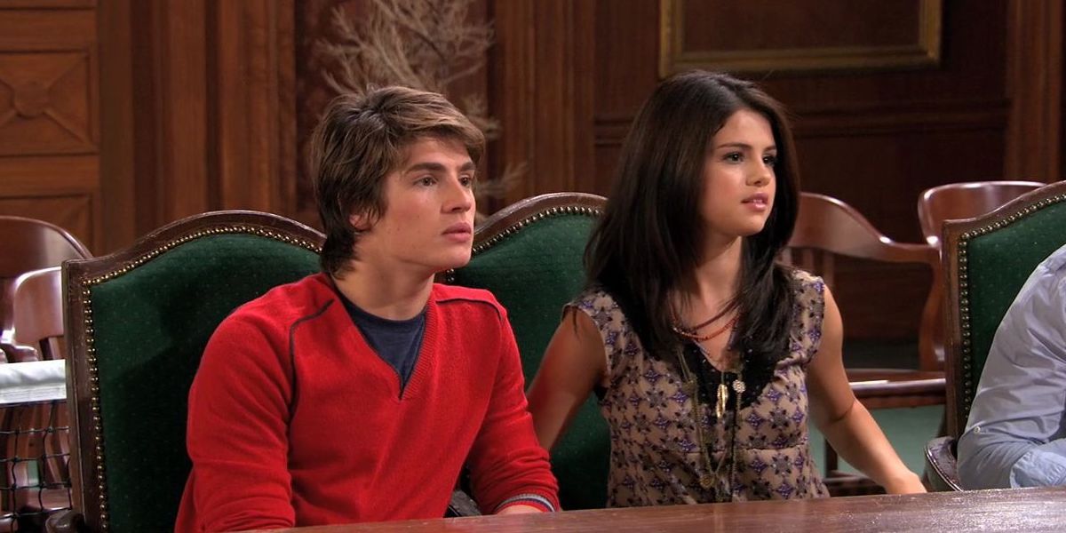 Alex and Mason sit at a table in Wizards of Waverly Place