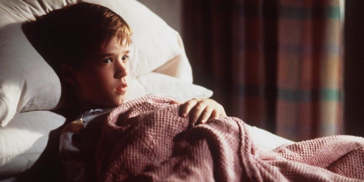 Cole lying in a hospital bed in The Sixth Sense