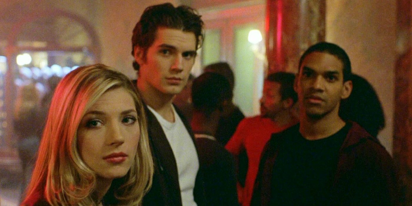 A group of teenagers looking in the same direction while at a party in Hellraiser: Hellworld.