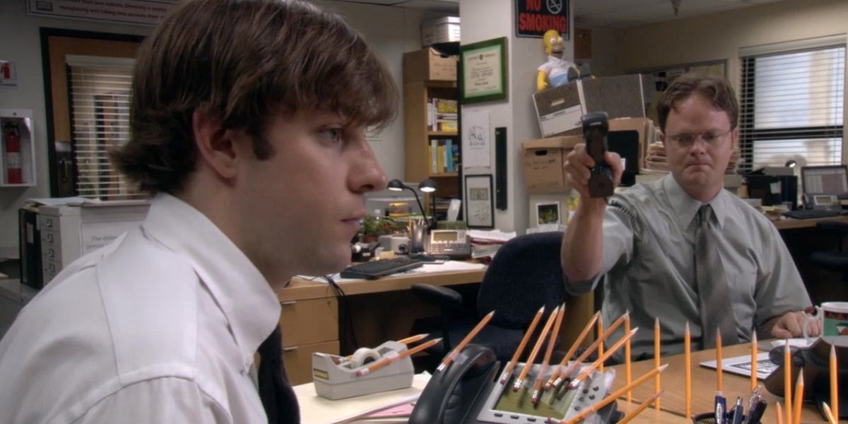 Dwight holds out his stapler at Jim