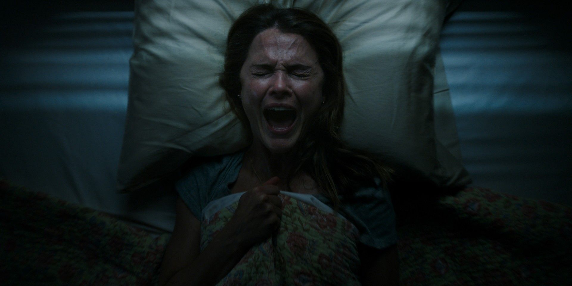 A woman screaming in bed in Antlers