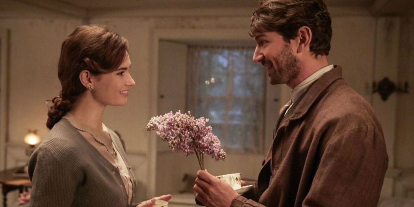 Dawsey giving Juliet flowers in The Guernsey Literary and Potato Peel Pie Society.