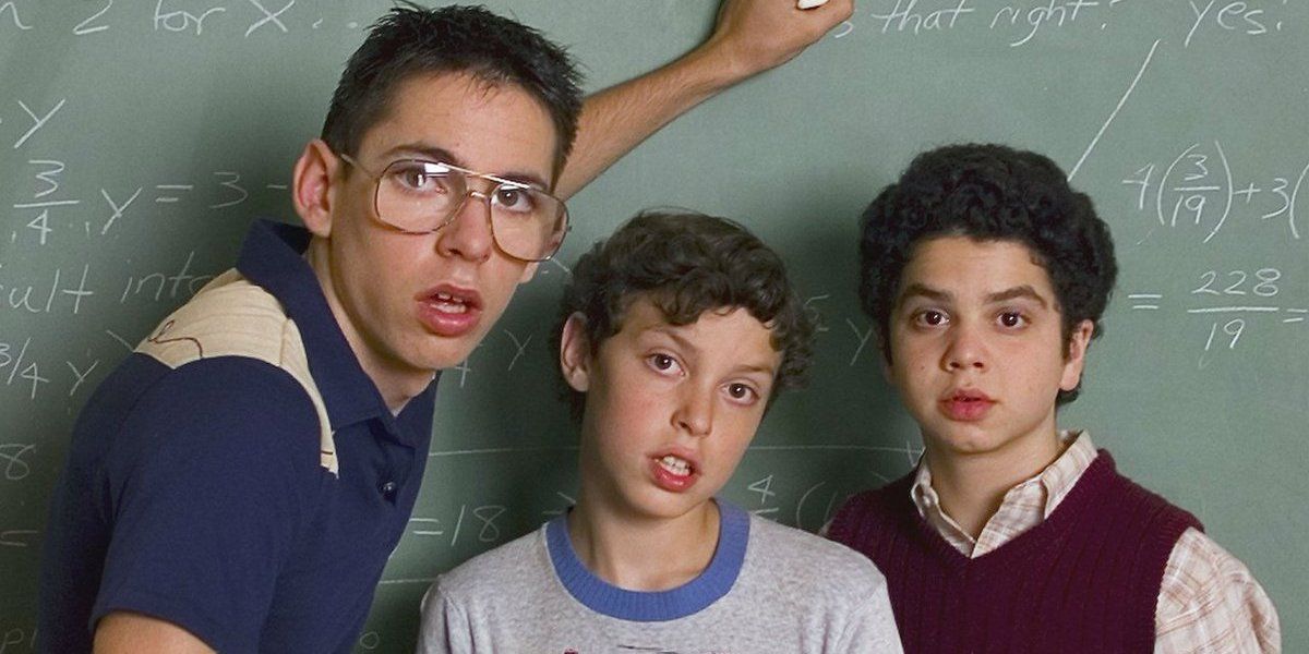 Bill, Sam, and Neal in front of a blackboard in Freaks and Geeks
