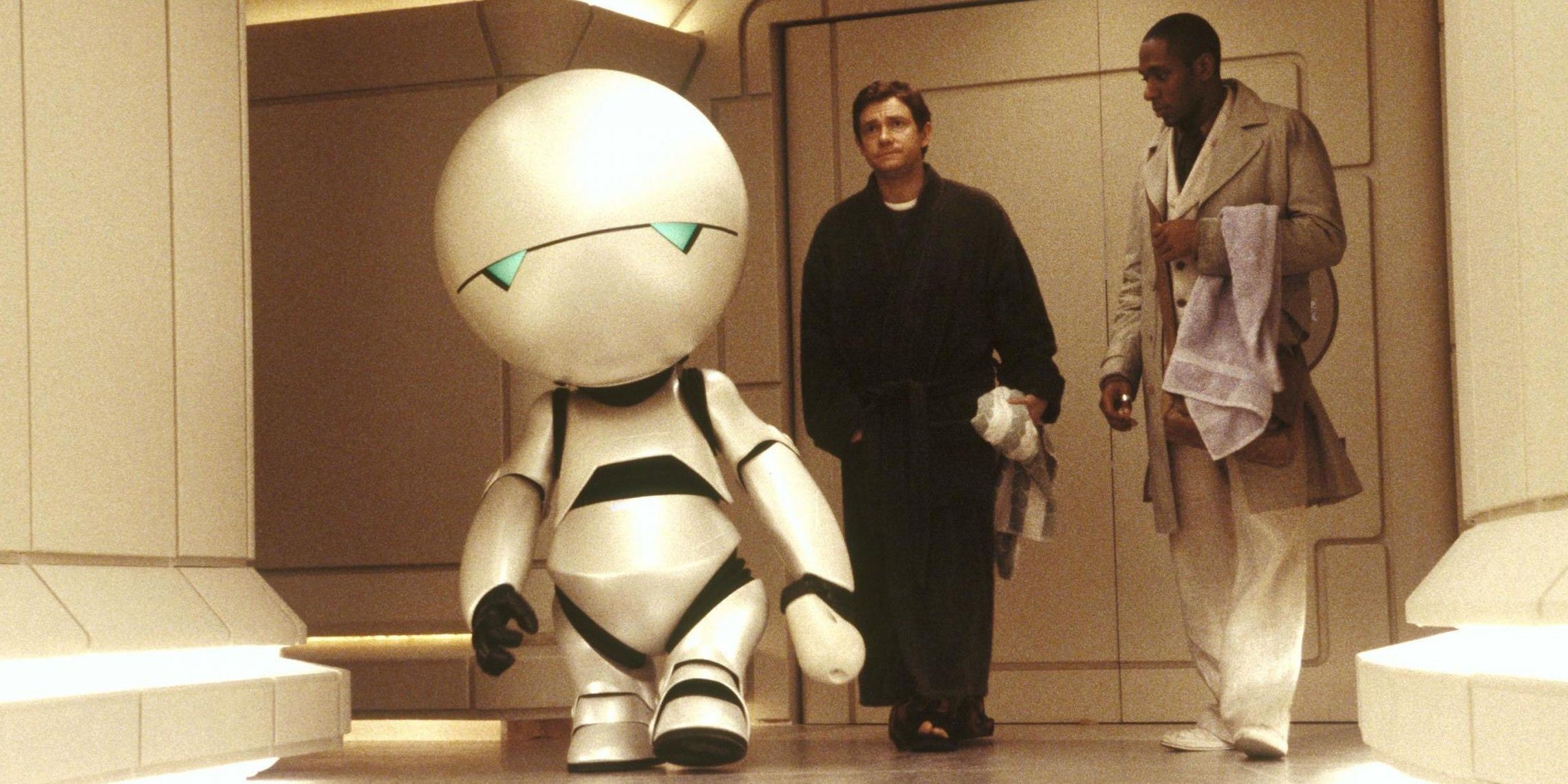 Marvin the Paranoid Android walks while Arthur Dent, played by Martin Freeman, and Ford Prefect, played by Mos Def, follow behind him in the 2005 movie adaptation of The Hitchhiker's Guide to the Galaxy.