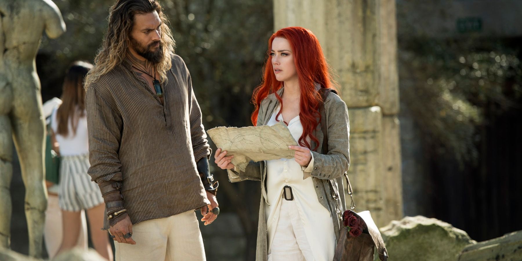 Aquaman and Mera look on a map in Aquaman