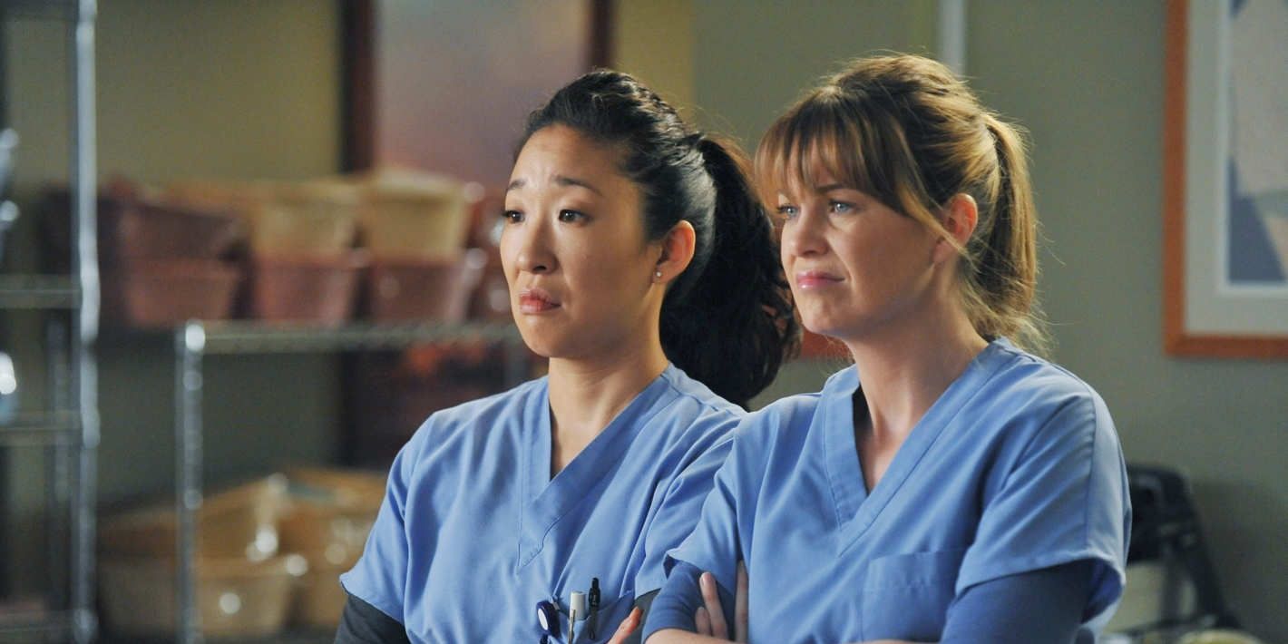 Cristina and Meredith look disgusted while wearing their hospital srubs in Grey's Anatomy.