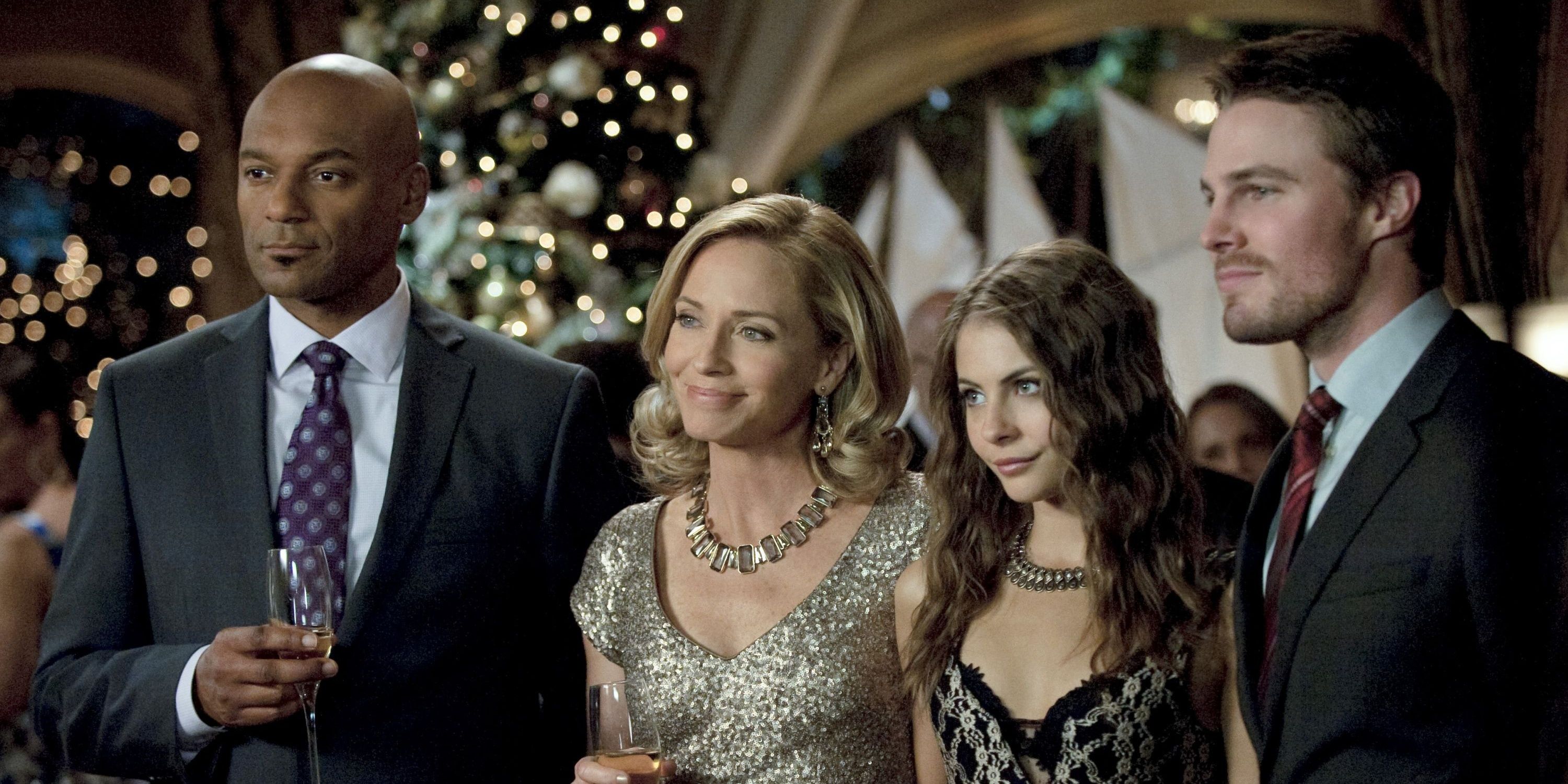 Arrow Walter, Moira, Thea and Oliver on a Christmas party