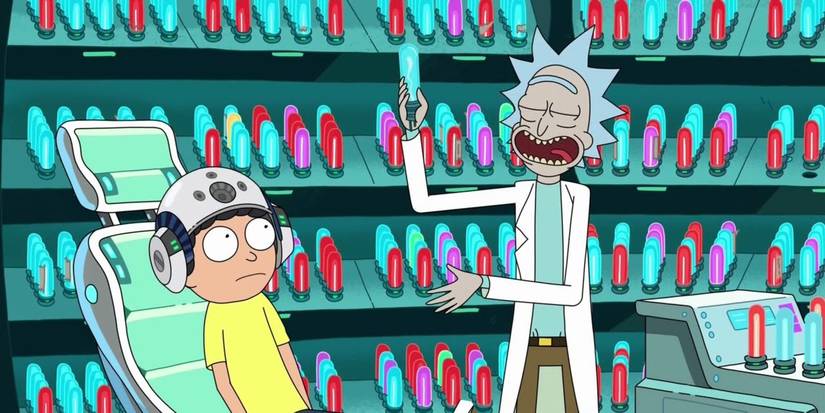 Rick holding up a tube of something while Morty sits in a chair with a helmet in Rick and Morty.