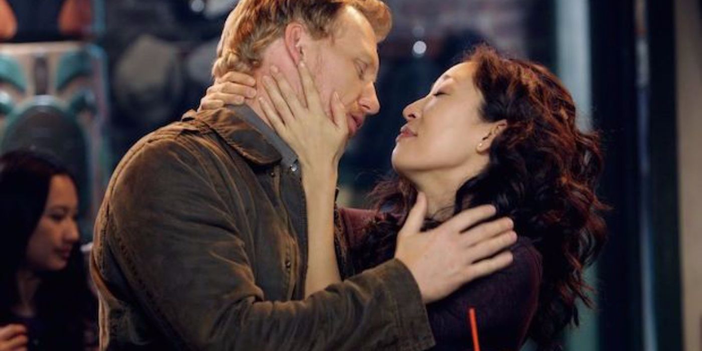 Owen and Cristina embrace and look into each other's eyes in Grey's Anatomy.