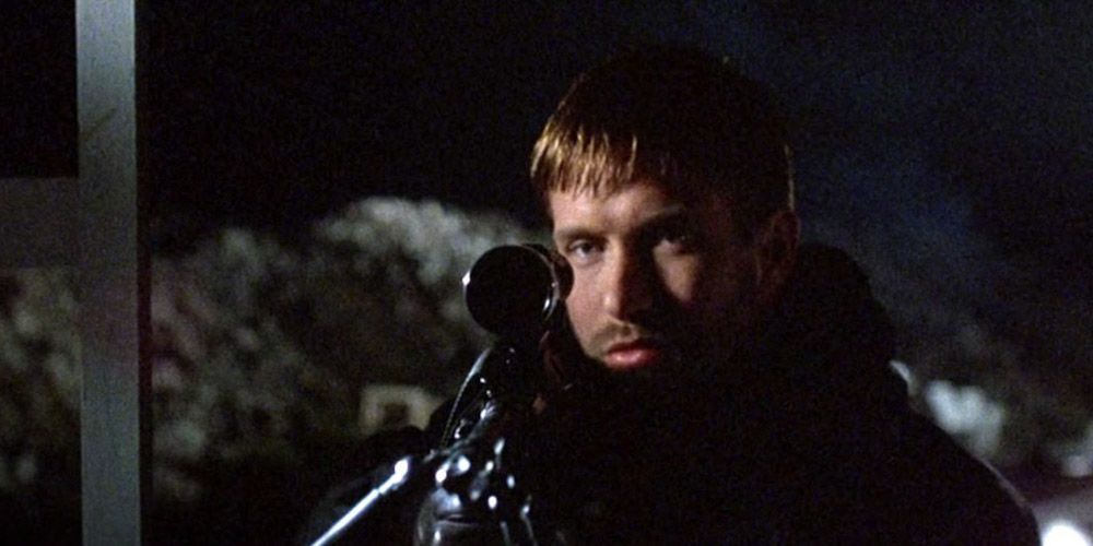 McManus looks through the scope of a sniper rifle in The Usual Suspects