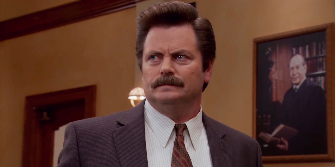 Ron Swanson frowning and looking annoyed in Parks and Recreation.