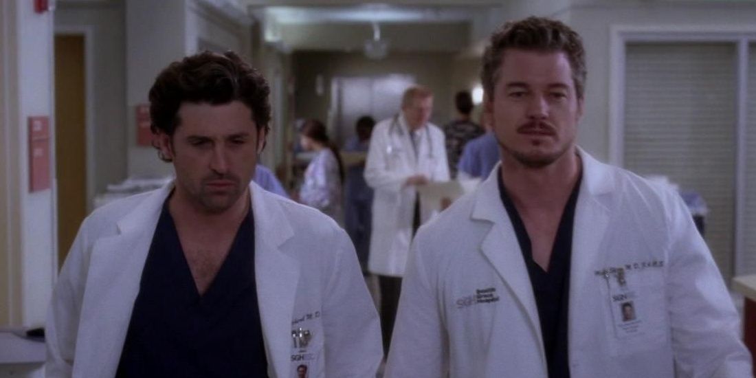 Derek and Mark walking in the hospital in Grey's Anatomy.