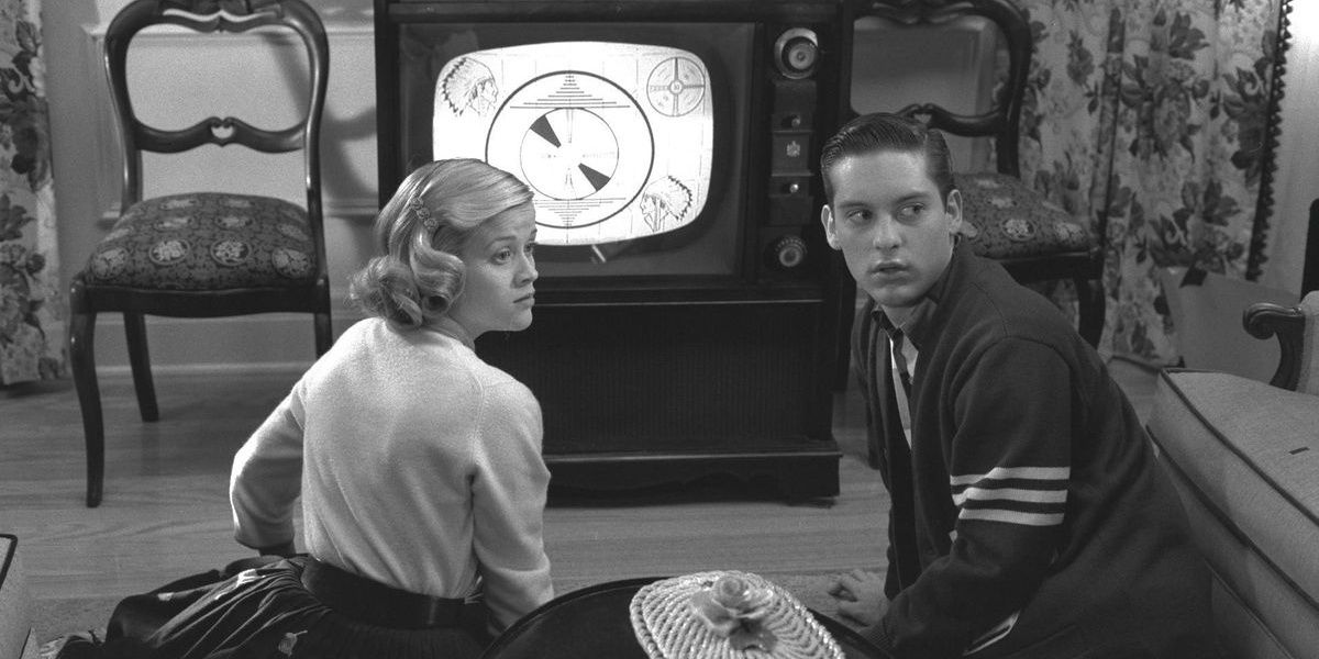 Two teens looks back in black and white from Pleasantville
