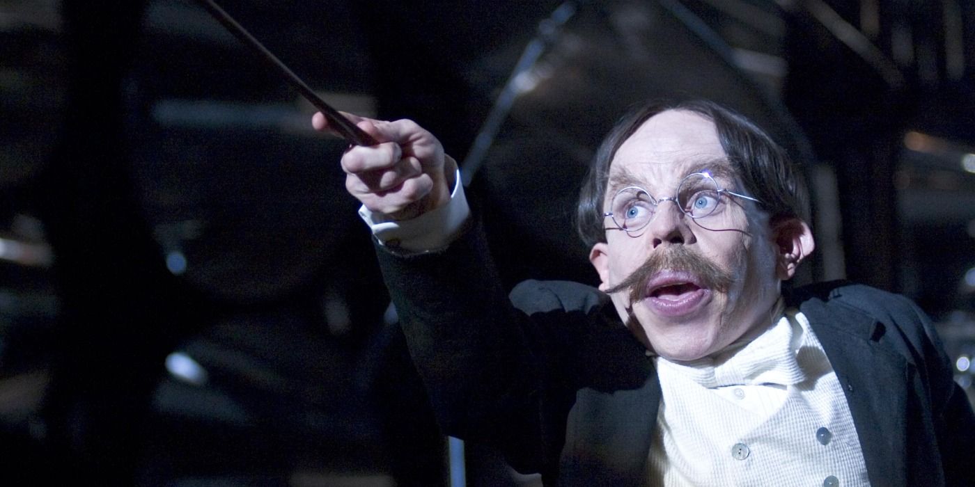 Professor Flitwick played by Warwick Davis in Harry Potter casting a spell.