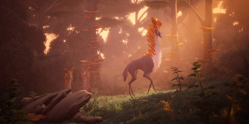 Everwild screenshot showing some long-necked deer creatures walking through a forest.