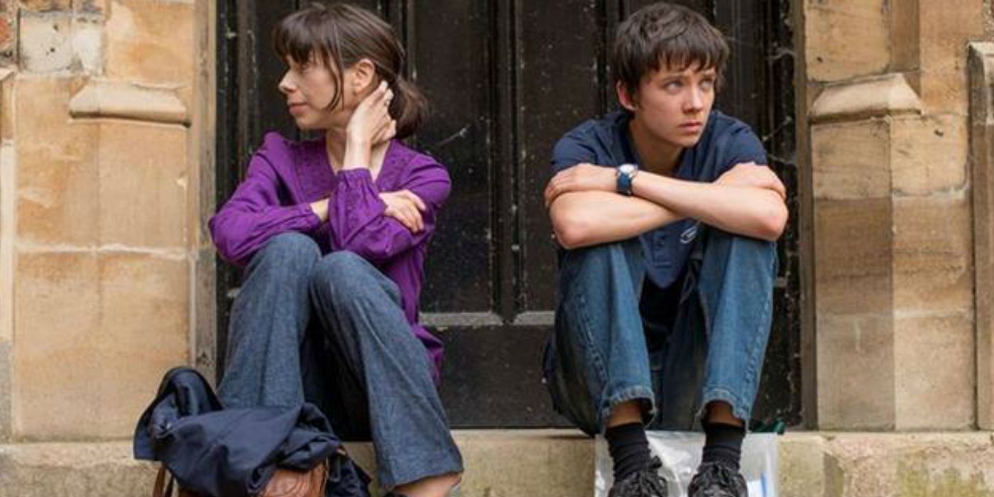 Asa Butterfield and Sally Hawkins sitting on the stairs in A Brilliant Young Mind (2014)