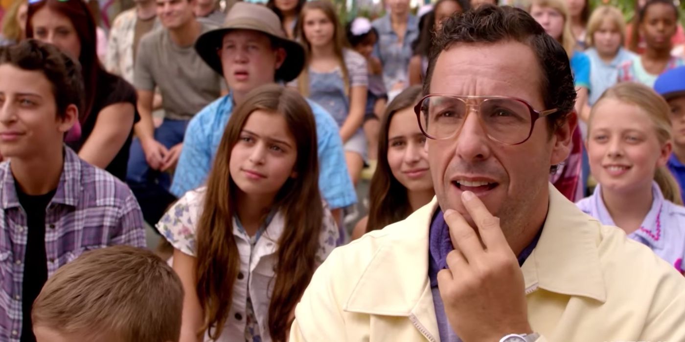 Adam Sandler looks on in Sandy Wexler