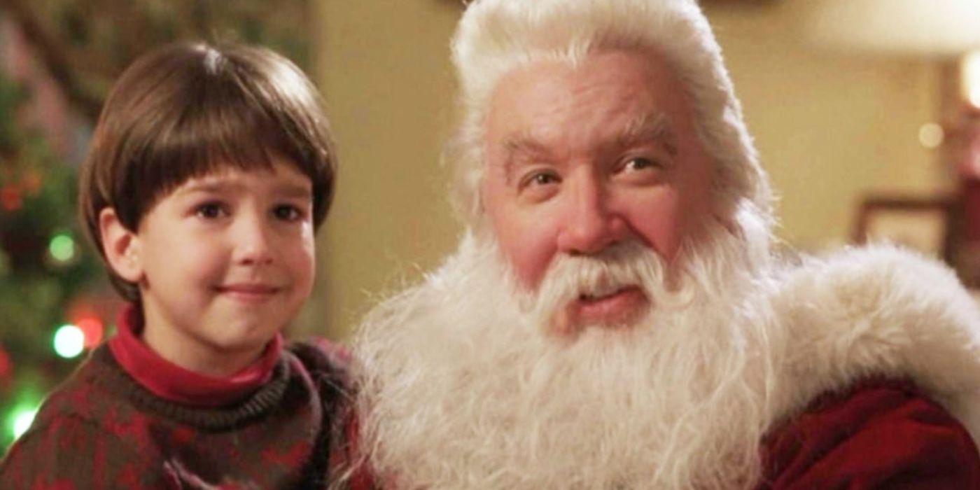 Scott and Charlie hugging with Scott dressed as Santa in The Santa Clause