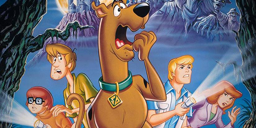 The gang has flashlights and looks scared in Scooby-Doo on Zombie Island.