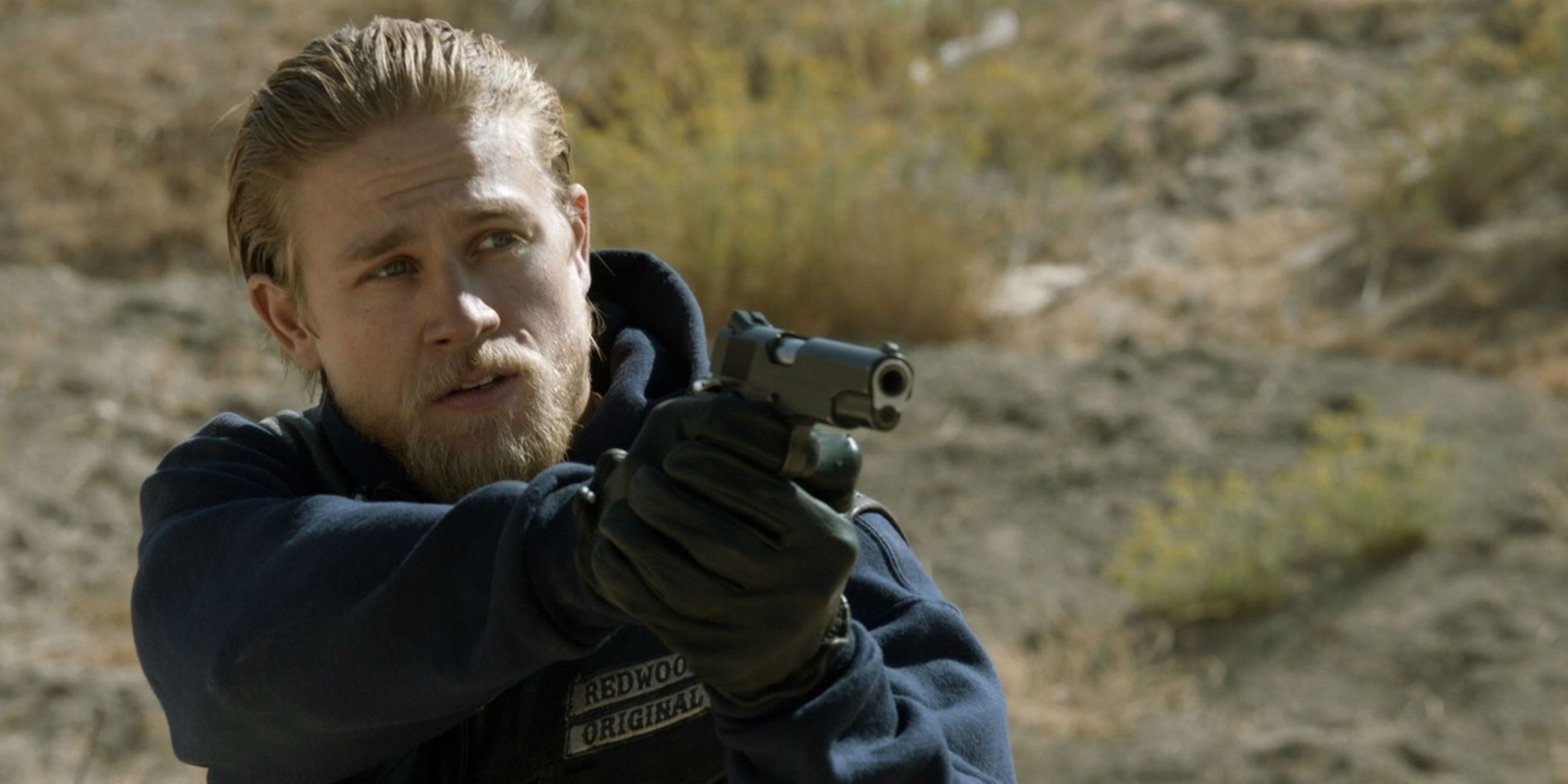 Jax aiming a gun in Sons of Anarchy
