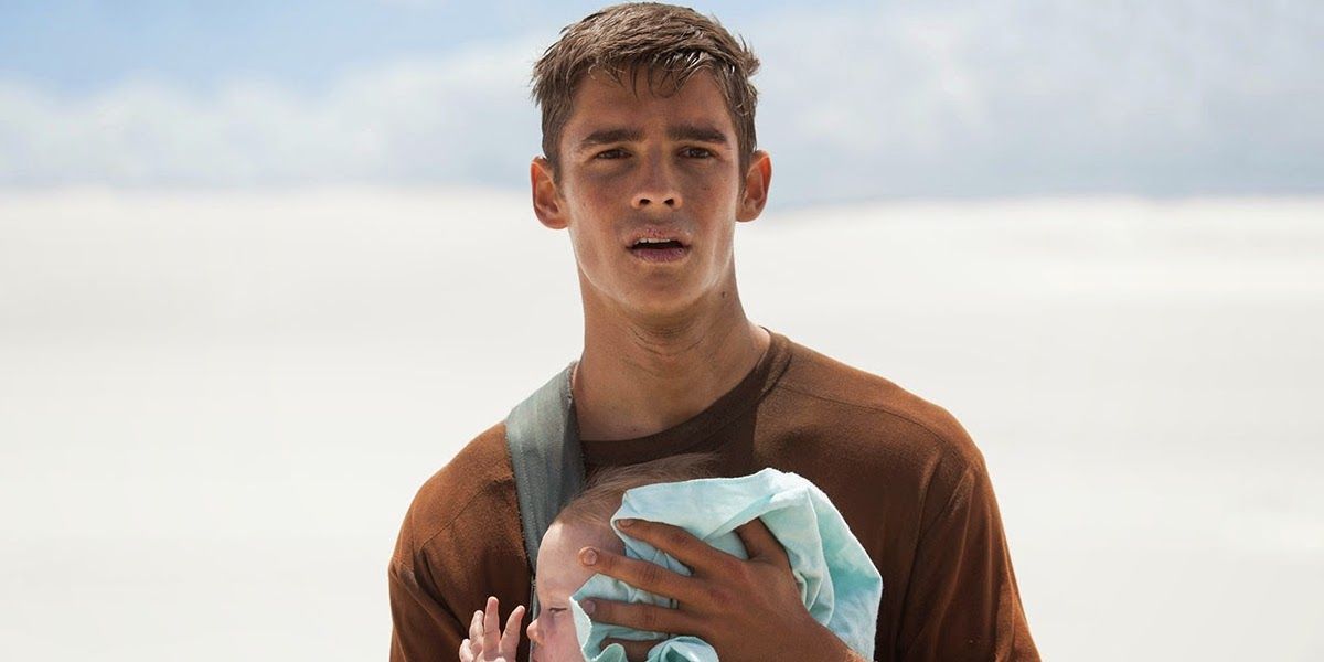 Jonah walking in the snow with the baby in The Giver.