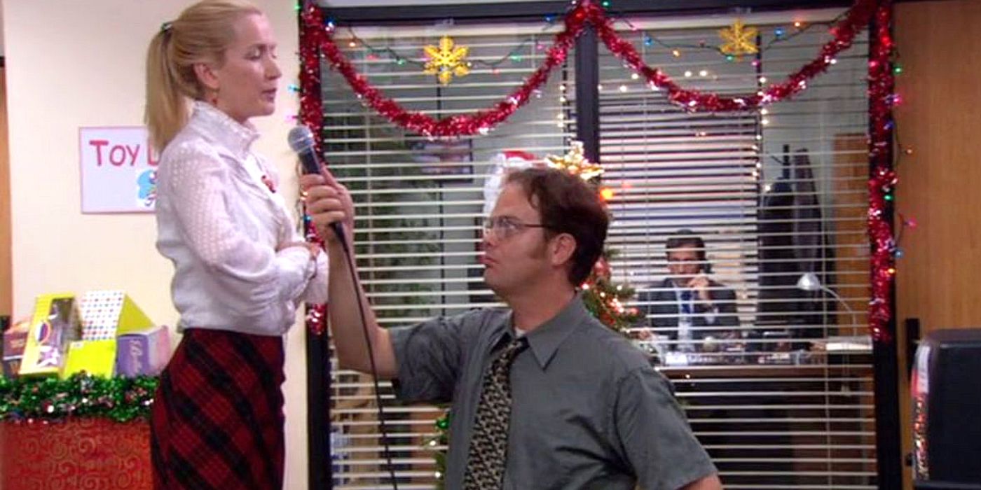 Dwight helps Angela sing at the christmas party on the office