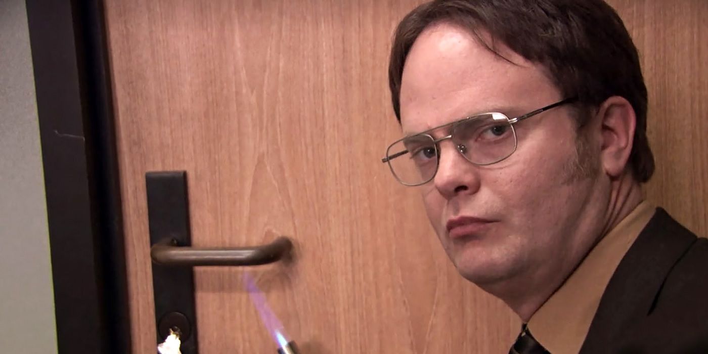 Dwight smugly heats a door handle with a blowtorch on The Office.