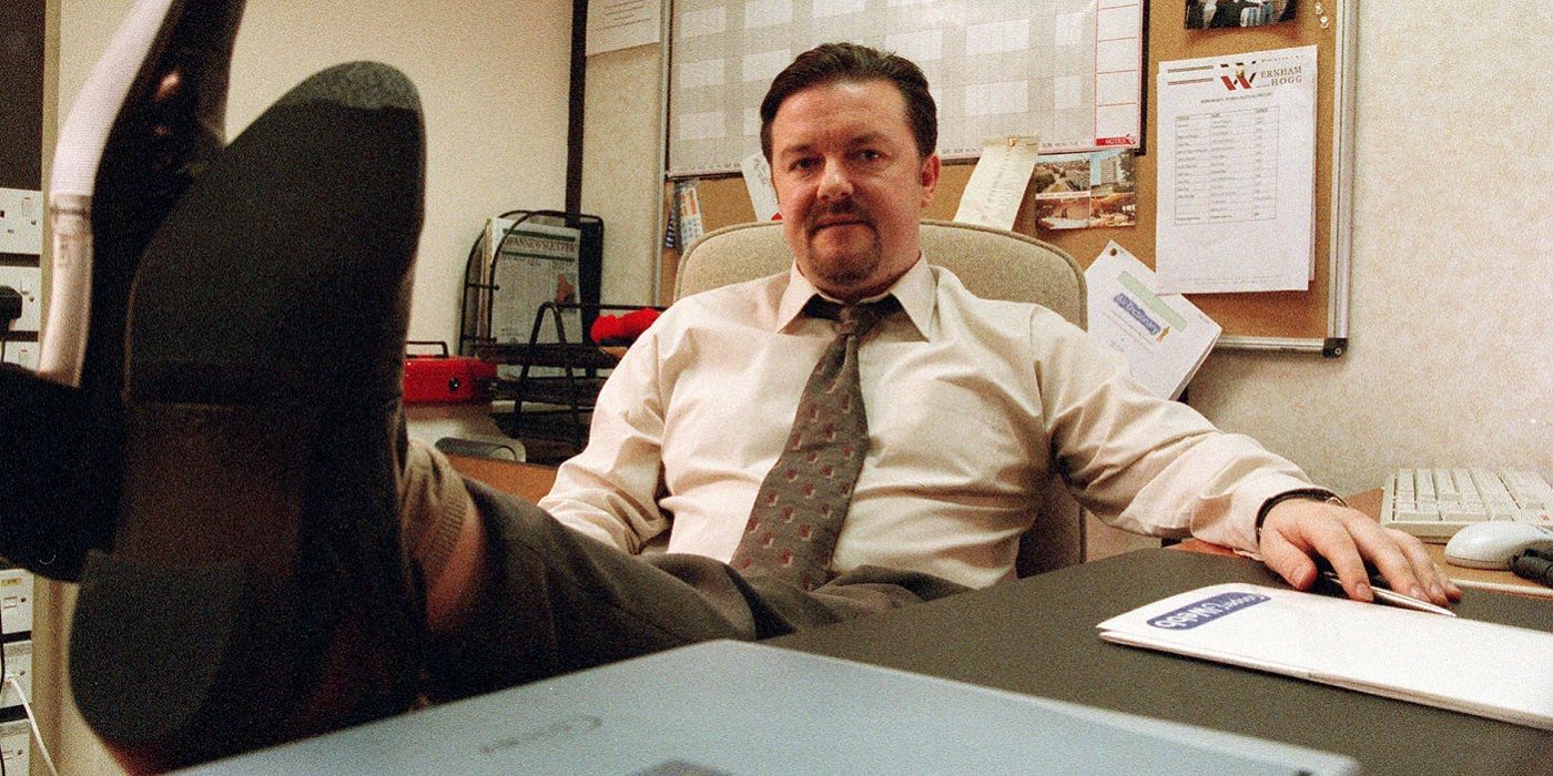 David Brent with his feet on his desk in The Office UK