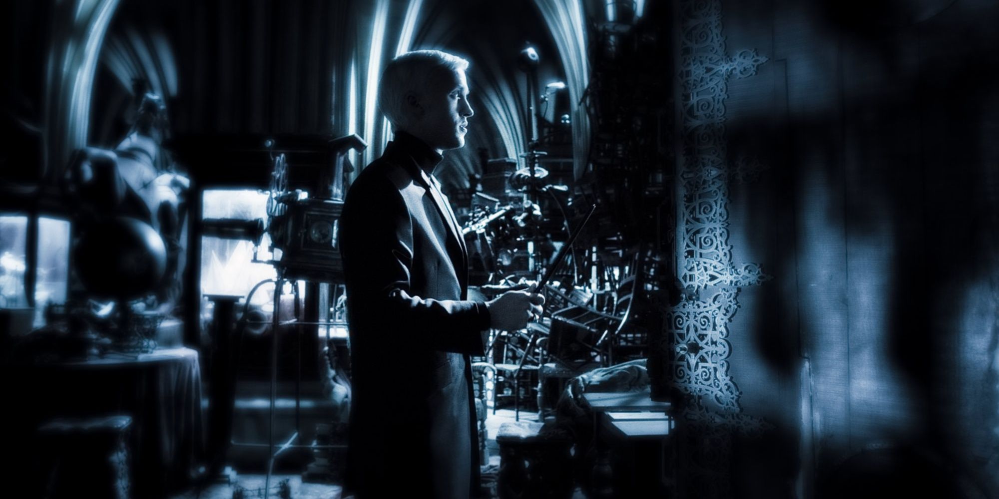 Draco Malfoy stands outside the Vanishing Cabinet at Borgin and Burkes in Harry Potter