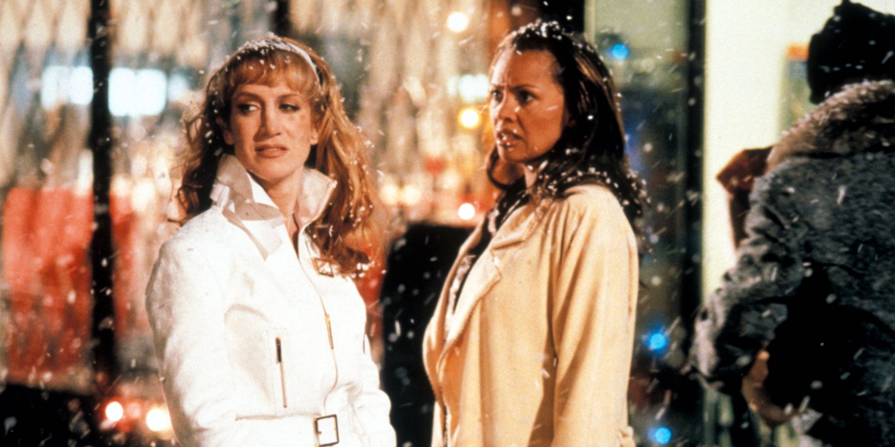 The ghost of Christmas past and Ebony Scrooge stand on the street in the snow in A Divas Christmas Carol